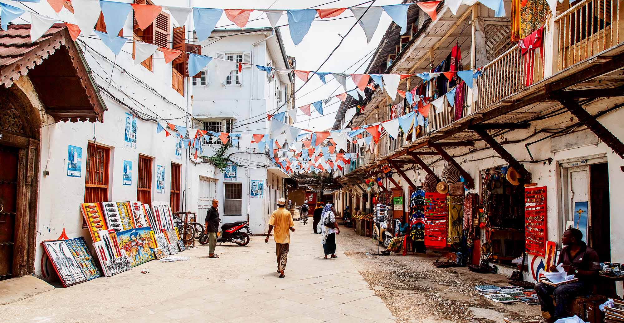 Stone Town: Local people on a street in Stone Town. Stone Town is the old part of Zanzibar City, the capital of Zanzibar, Tanzania